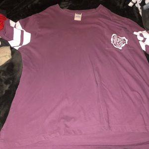 a purple shirt from Victoria’s Secret, PINK
